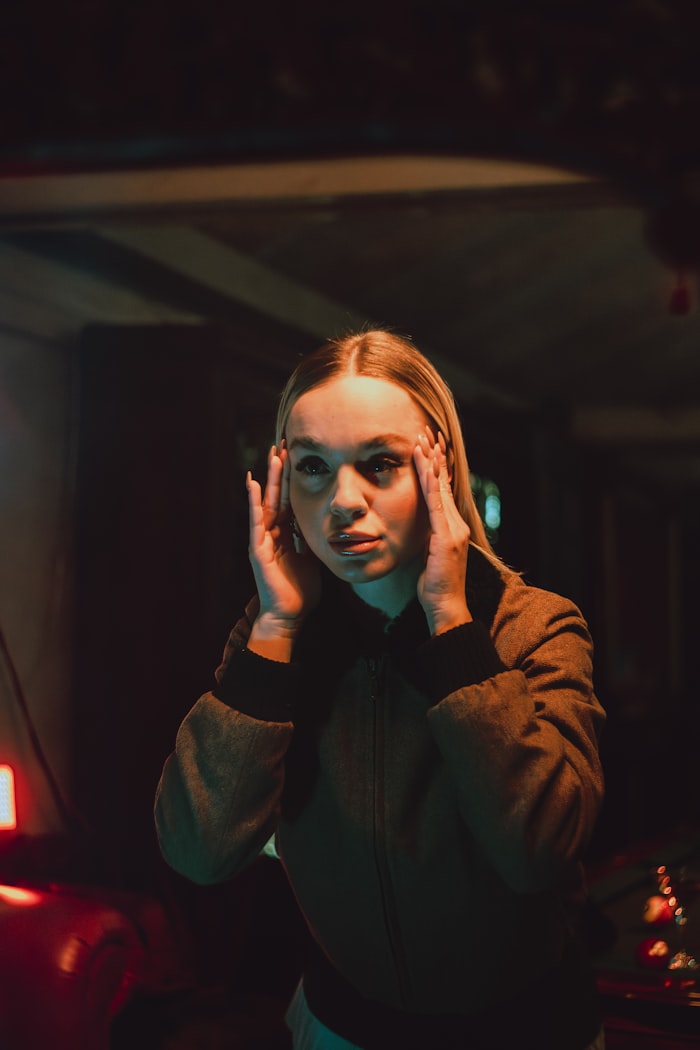 Woman holding her head in her hands — representing anxiety